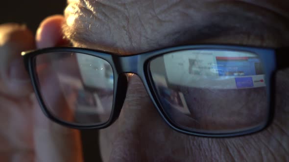 Closeup of the Focused Eyes of a Businessman Wearing Computer Glasses alt
