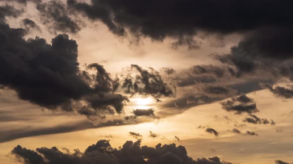 Sunset with dramatic cloud and ray light on orange sky