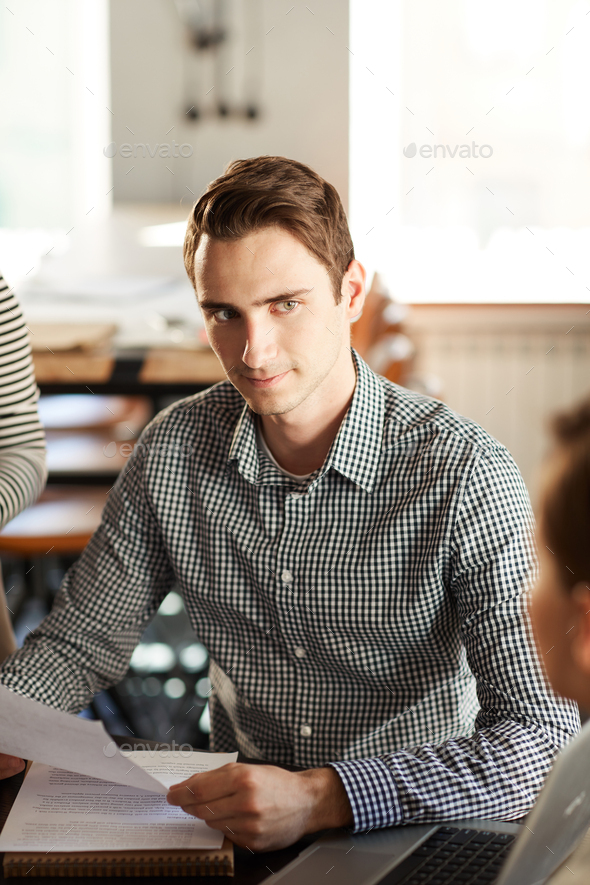Handsome Man Listening to Colleagues - Stock Photo - Images