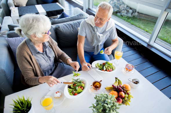 Senior Couple Enjoying Lunch - Stock Photo - Images