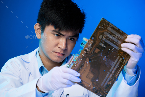 Engineer with circuit board - Stock Photo - Images
