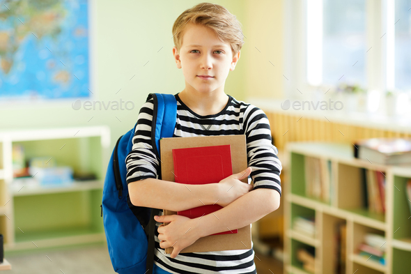 Confident Schoolboy With Fashionable Hairstyle Stock Photo By