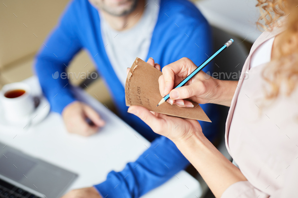 Making notes about customers order in cafe - Stock Photo - Images