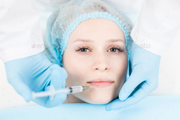 Lip filler injection - Stock Photo - Images