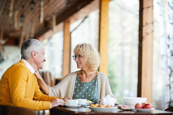 Happy senior wife supporting husband - Stock Photo - Images