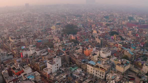 India, Delhi city center slums roofs aerial 4k drone footage, evening dusk alt