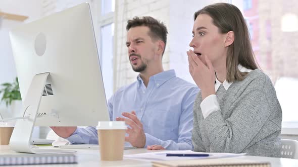 Shocked Creative Team Reacting To Failure on Desktop in Office alt