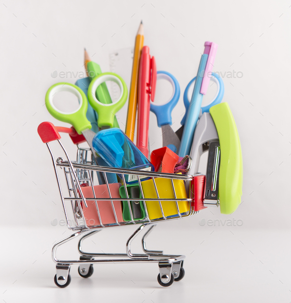 Close up of shopping cart with purchases from stationery shop