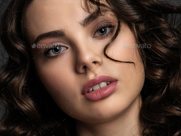 Portrait of a  beautiful woman with a smoky eye makeup - Stock Photo - Images