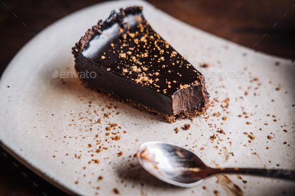 Slice of raw vegan dark chocolate cake