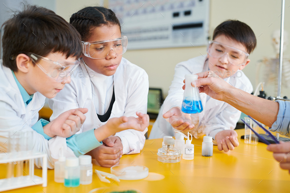 Kids at chemistry lesson - Stock Photo - Images