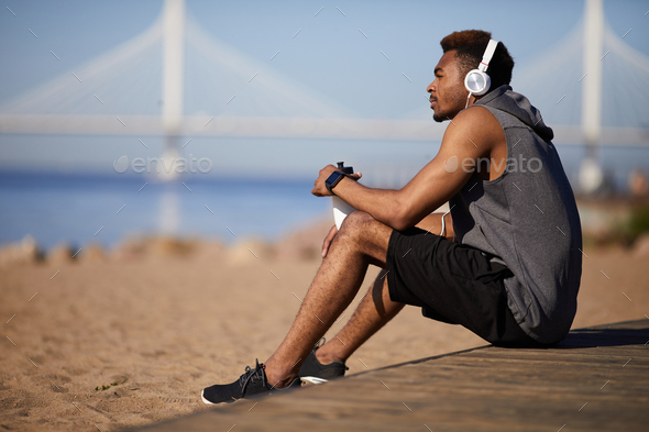 Thoughtful black man resting after training