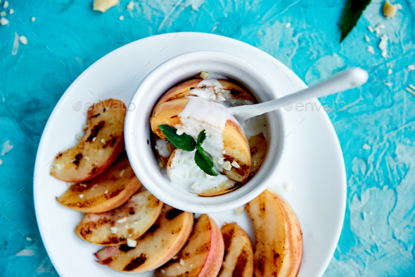 Grilled peach with ice creame on white plate - Stock Photo - Images