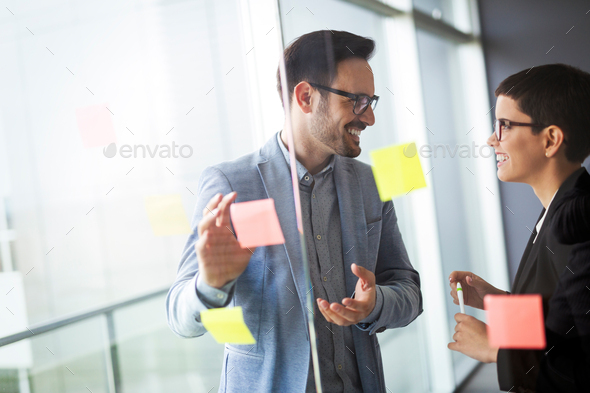 Business people meeting at office and use post it notes to share idea