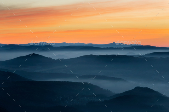 Dramatic sunrise over beautiful mountain peaks. Decinsky Sneznik, Czech republic - Stock Photo - Images