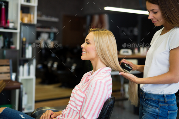 Happy woman at the hair salon - Stock Photo - Images