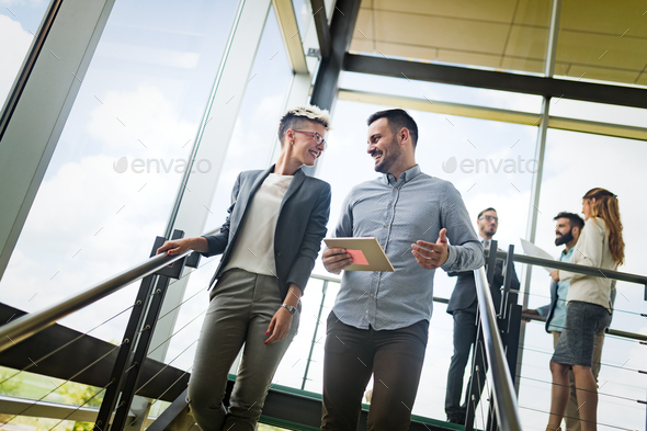 Happy colleagues casual chat at the office - Stock Photo - Images