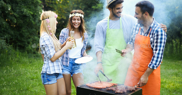 Happy people having camping and having bbq party - Stock Photo - Images