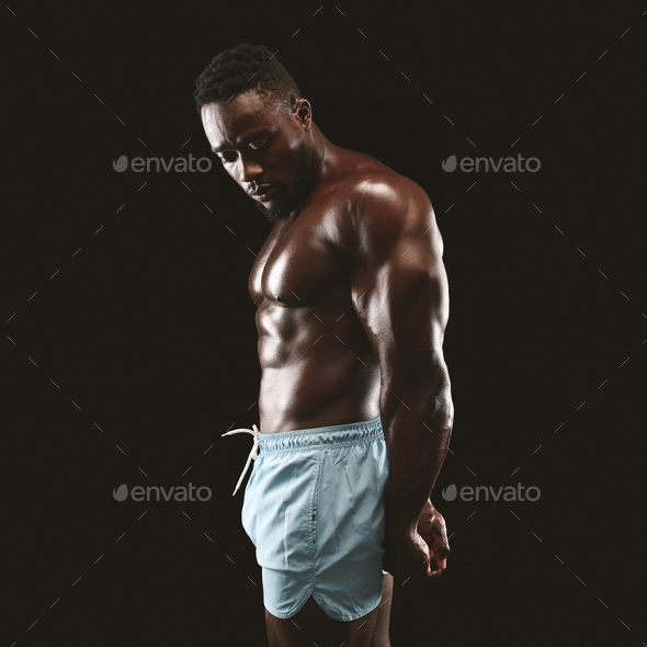 MAASTRICHT, THE NETHERLANDS - OCTOBER 25, 2015: Male bodybuilder flexes his  muscles and shows his best physique in a side pose Stock Photo - Alamy