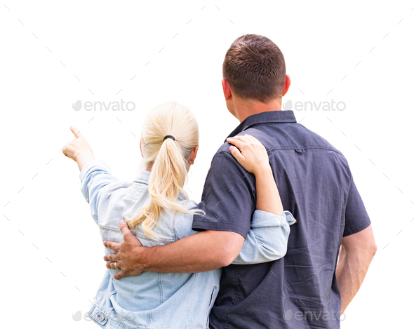 Young Adult Couple Facing Away and Pointing Isolated On A White Background.
