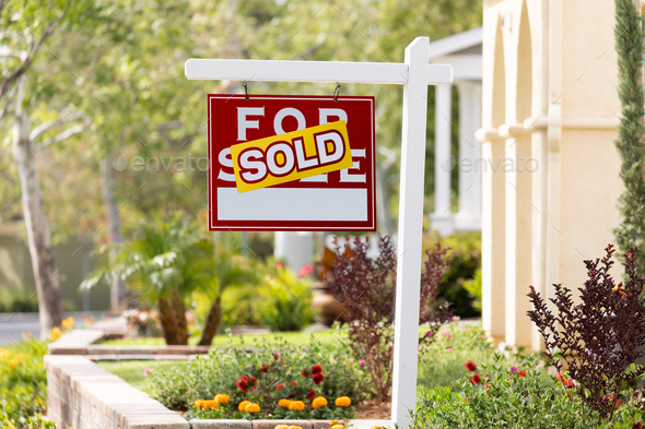 Sold Home For Sale Real Estate Sign in Front of New House. - Stock Photo - Images