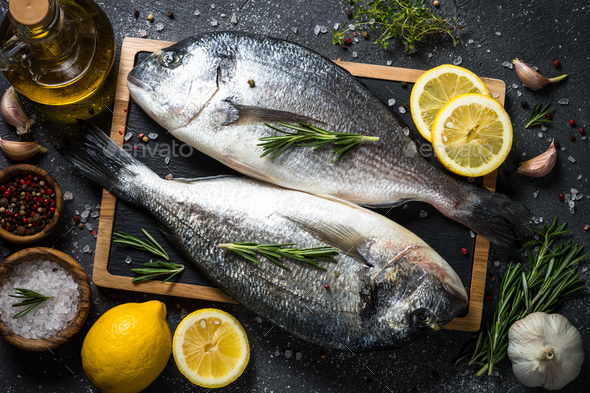 Raw Dorado Fish On Black Stock Photo By Nadianb Photodune