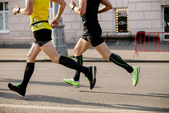 two men runners in compression socks