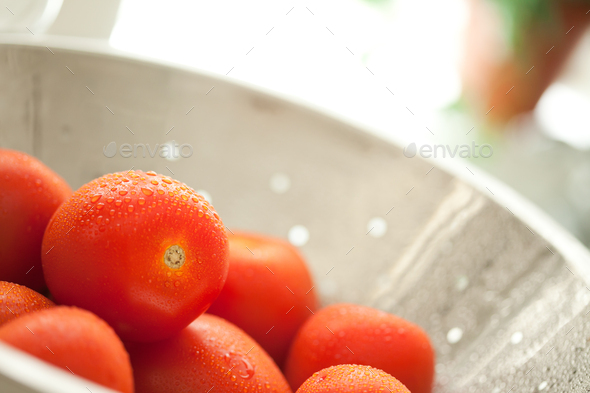 Macro of Fresh, Vibrant Roma Tomatoes in Colander with Water Drops Abstract. - Stock Photo - Images