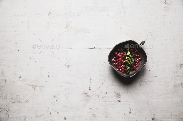 Food photo of pomegranate pieces in bowl on the table with copy space. Healthy food, fruit, diet - Stock Photo - Images