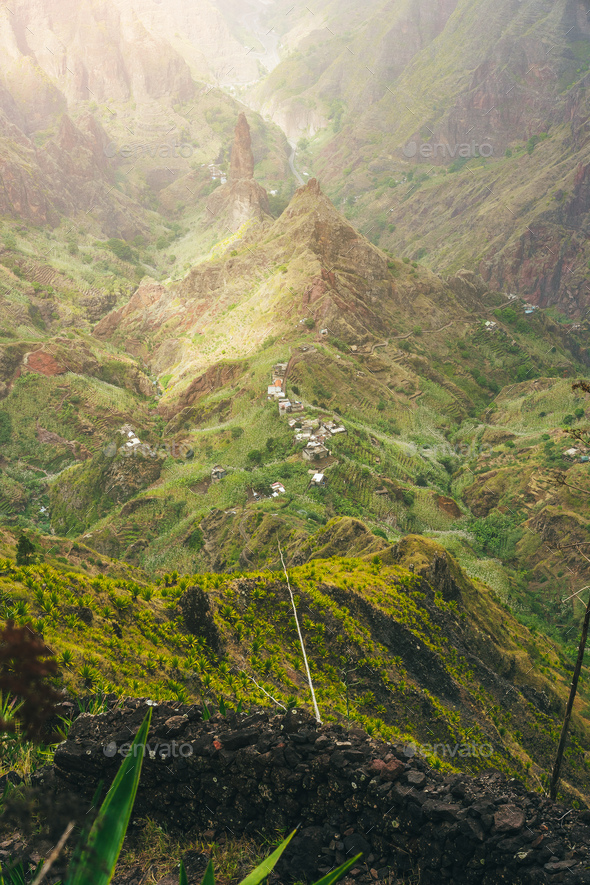 Mountain peaks of Xo-Xo valley in sun light. Local village in the valley. Many agava plants grow on - Stock Photo - Images