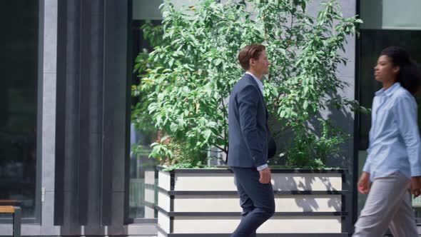 Bank Manager Going for Walk on Lunch Break in Modern Downtown City Street alt
