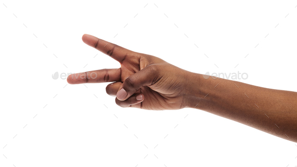 Female hand showing two fingers, peace or v-sign on white background