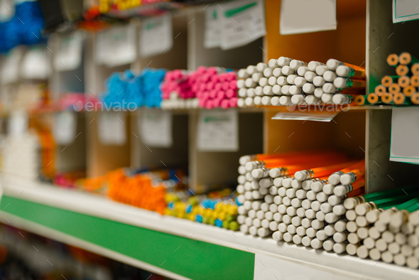 Shelf with pencils in stationery store, nobody