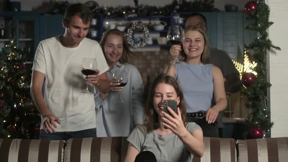 group young people congratulate friends on Christmas and new year video link. alt
