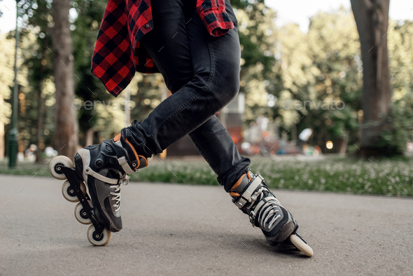 Roller skating, male skater rolling in park