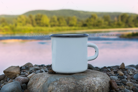 Download White Campfire Enamel Mug Mockup With Sunrise River View Stock Photo By Tasipas