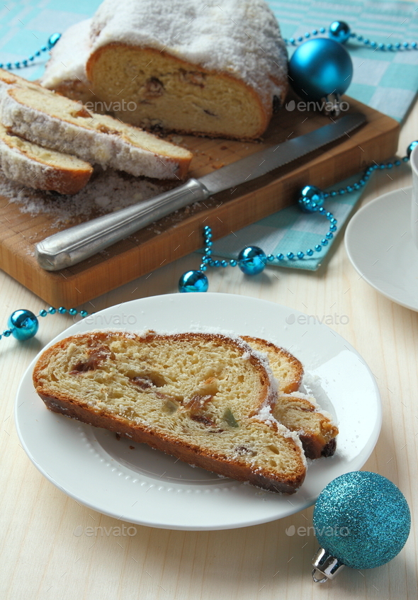 Sliced stollen with christmas decoration, a traditional German fruit ...