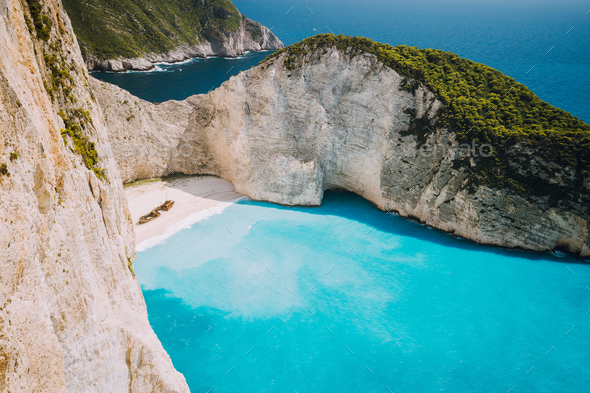 Navagio beach or Shipwreck bay with turquoise water and pebble white beach. Famous landmark location - Stock Photo - Images