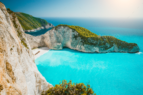 Navagio beach or Shipwreck bay panoramic. Turquoise sea water and white beach between huge cliffs - Stock Photo - Images