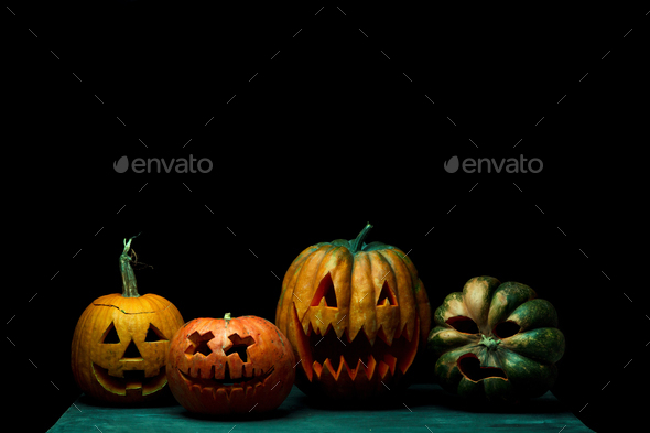 Halloween pumpkin head jack lantern with scary evil faces