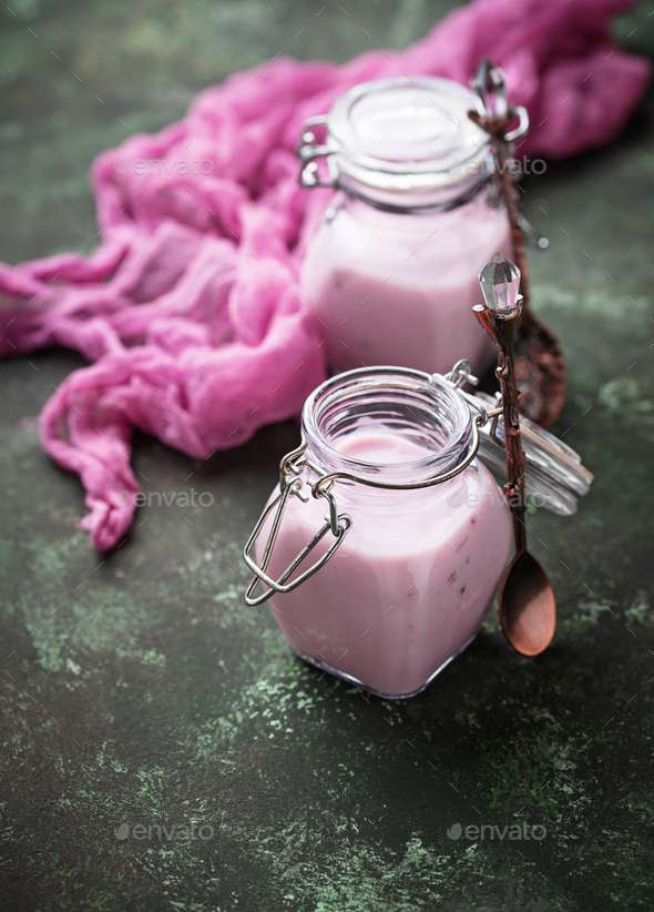 Sweet yogurt with berry in a glass jars Stock Photo by furmanphoto