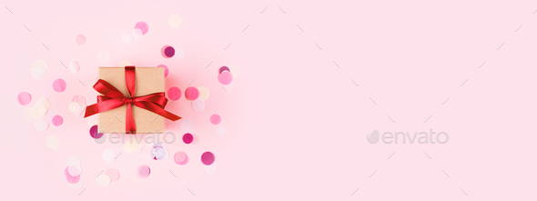Banner With Gift Box And Confetti On Pink Background Stock Photo