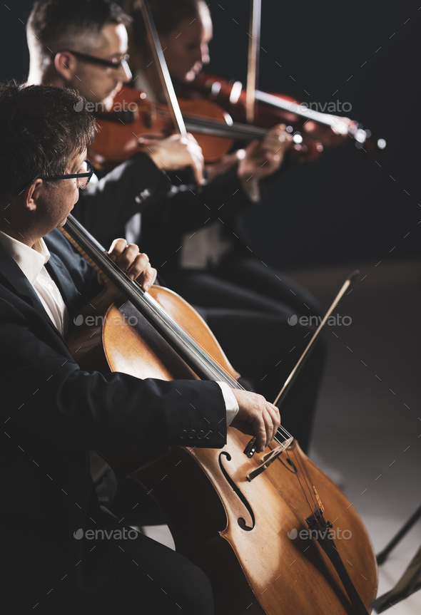 Symphonic orchestra performing on stage - Stock Photo - Images