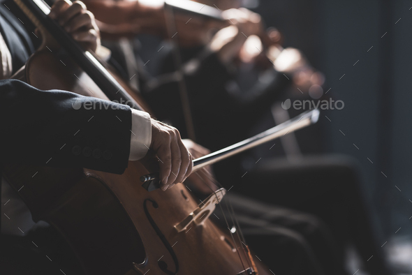 Symphonic orchestra performing on stage - Stock Photo - Images