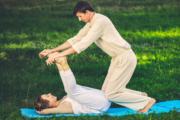 Thai massage with yoga exercises - Stock Photo - Images