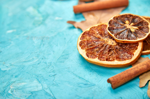 Autumn composition background with slices of dried oranges, leaves and cinnamon. - Stock Photo - Images