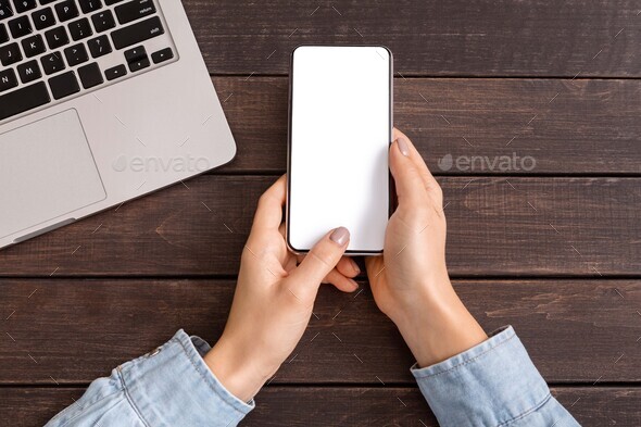 Smartphone with blank screen for your advertising in woman's hands