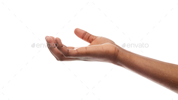 Afro female hand holding some invisible items on white background - Stock Photo - Images