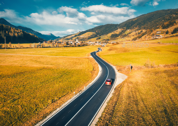 Aerial view of the road in mountain valley at sunset in autumn - Stock Photo - Images