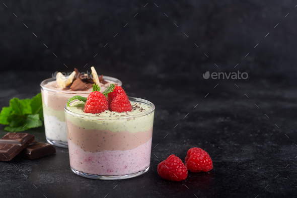 Chia seed pudding with three flavors, cocoa, matcha and strawberry with yoghurt, chocolate and mint - Stock Photo - Images